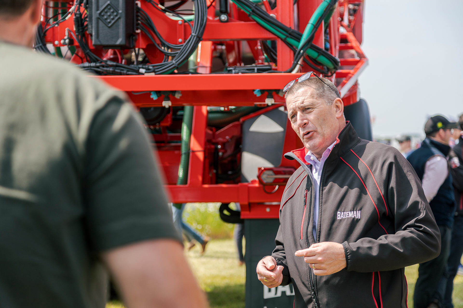 bateman-technical-sales-manager-david-main-at-cereals-2025 david main chatting with bateman customers at cereals 2025