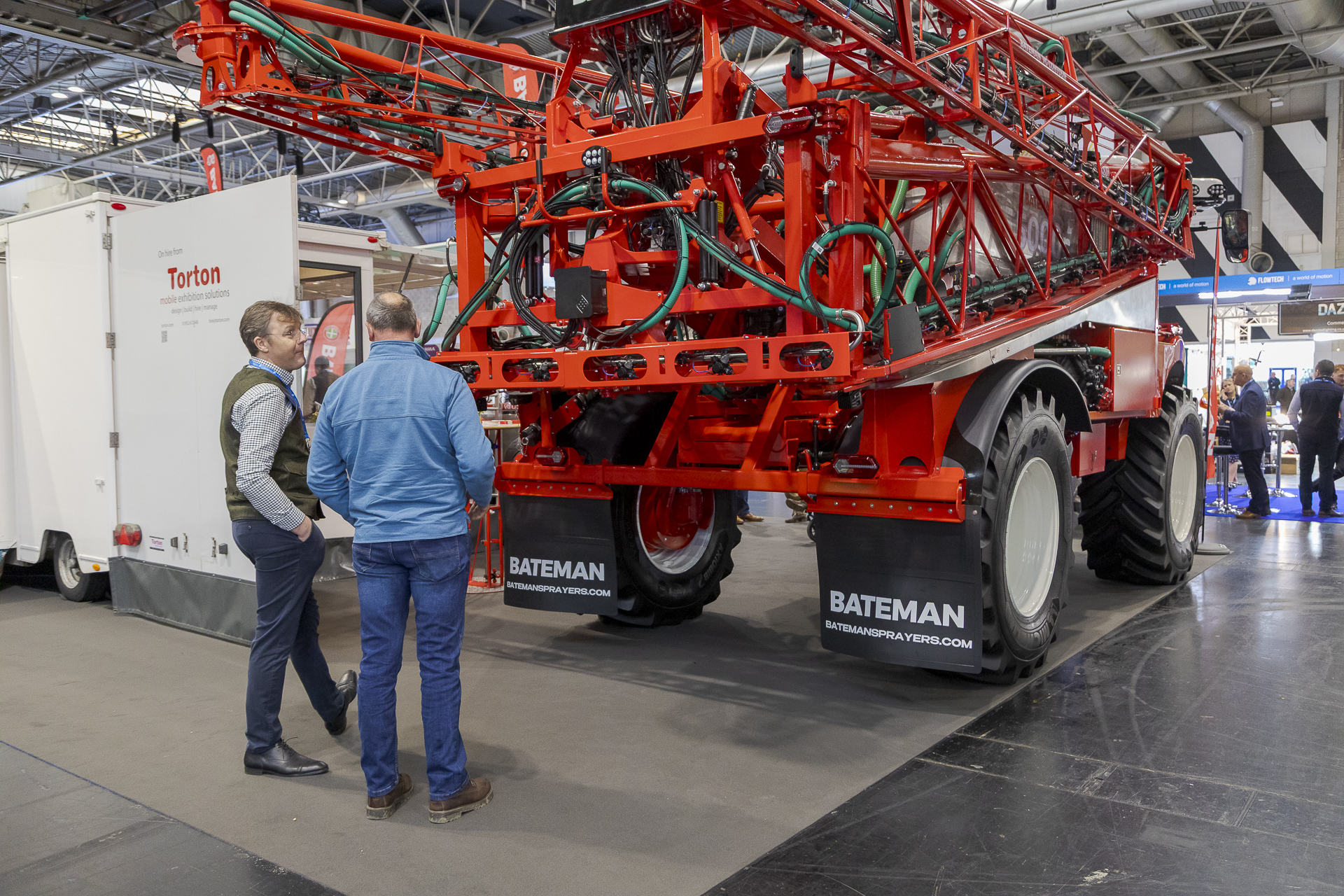 Managing Director Jason Bateman discusses the new VG boom with a customer at LAMMA Show